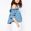 ASOS Denim Off Shoulder Top With Frill Detail In Mid Wash Blue €42.25